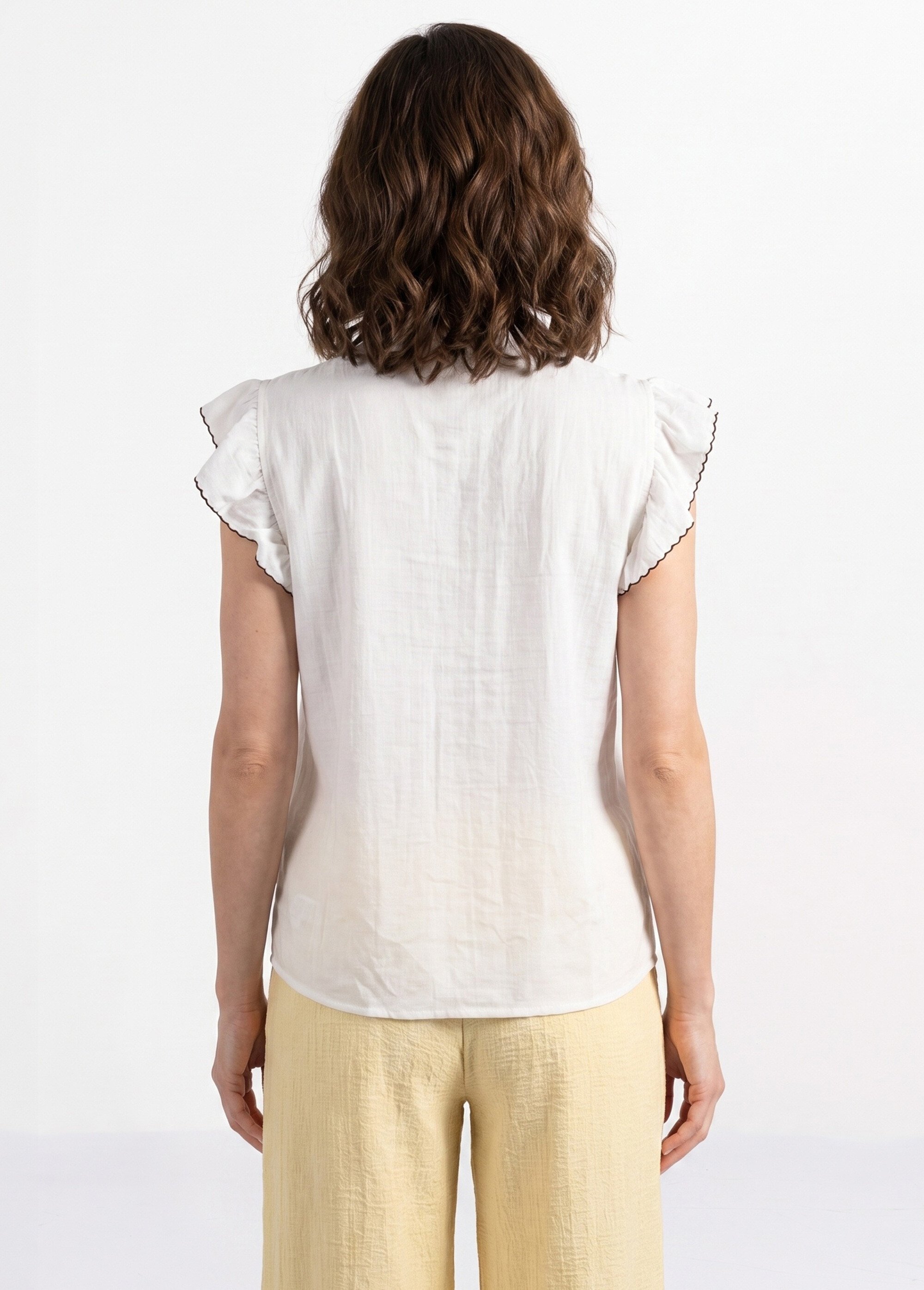 Blouse à sequins et broderies et volants