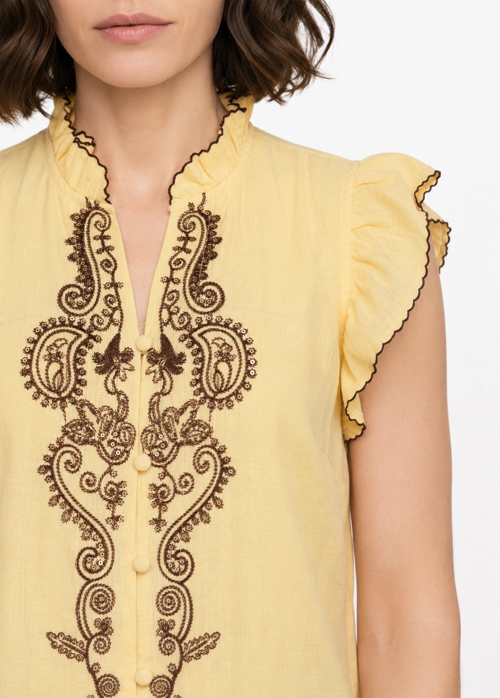 Blouse à sequins et broderies et volants