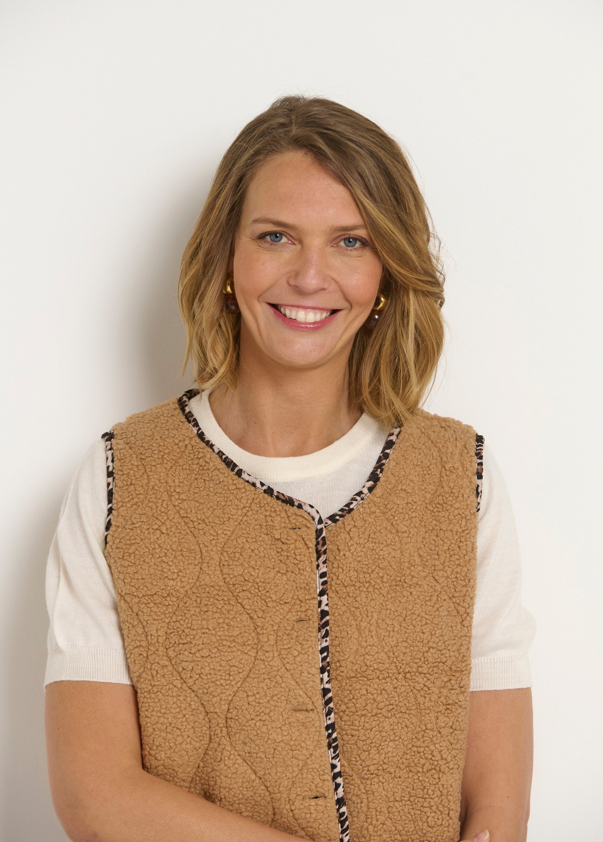Gilet sans manches boutonné en moumoute