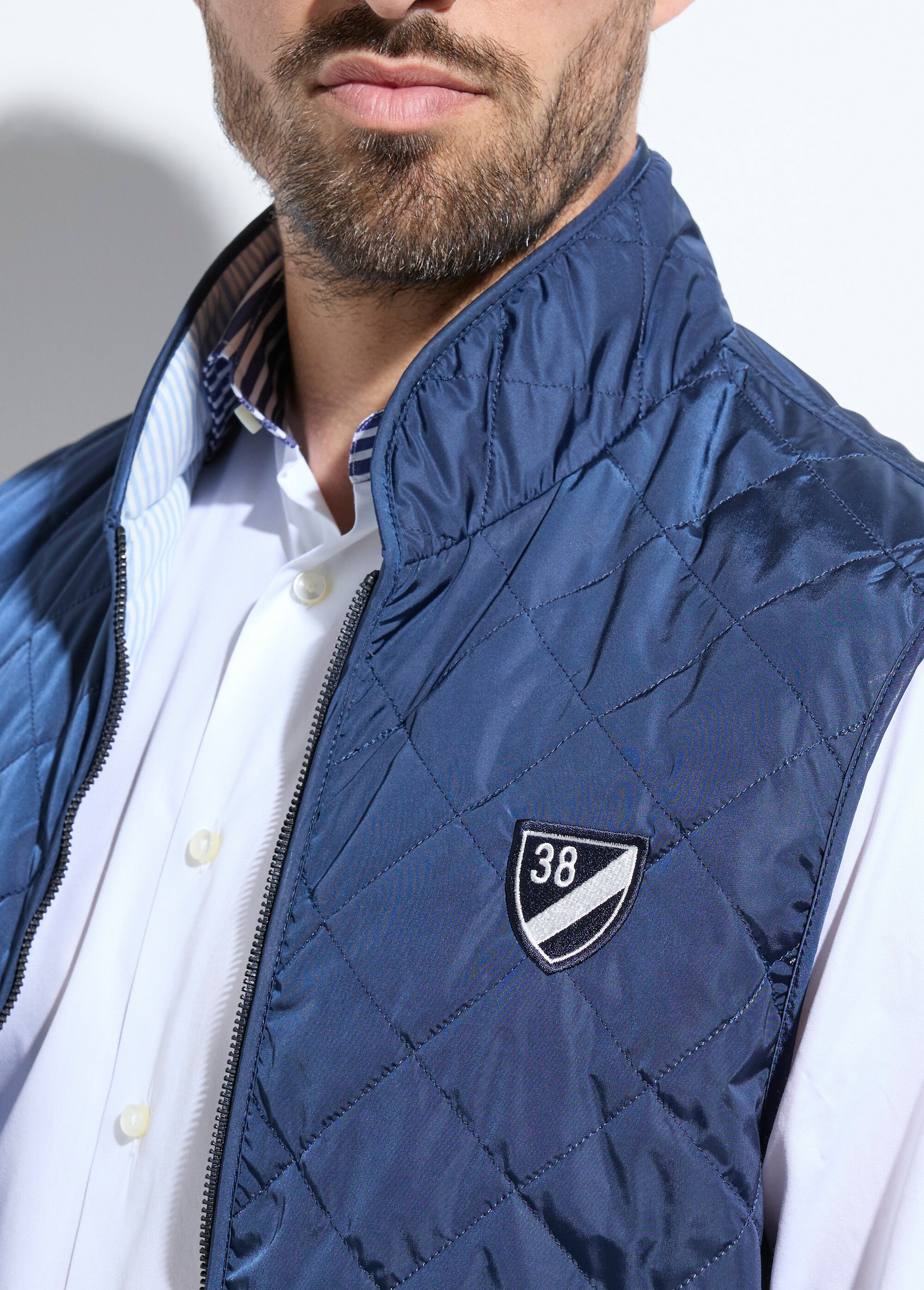 Veste sans manches matelassée avec surpiqûres