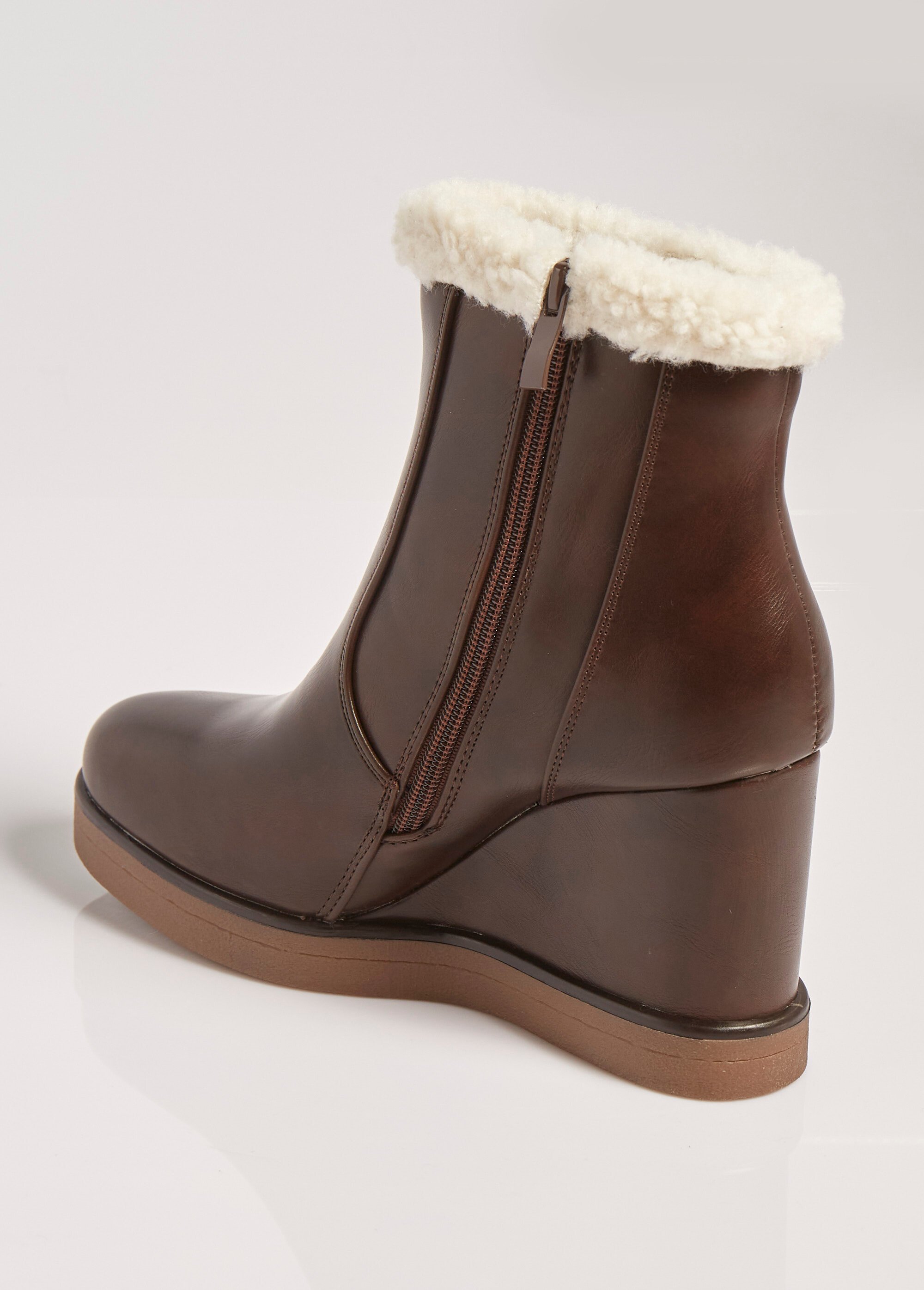 Boots fourrées à talon compensé