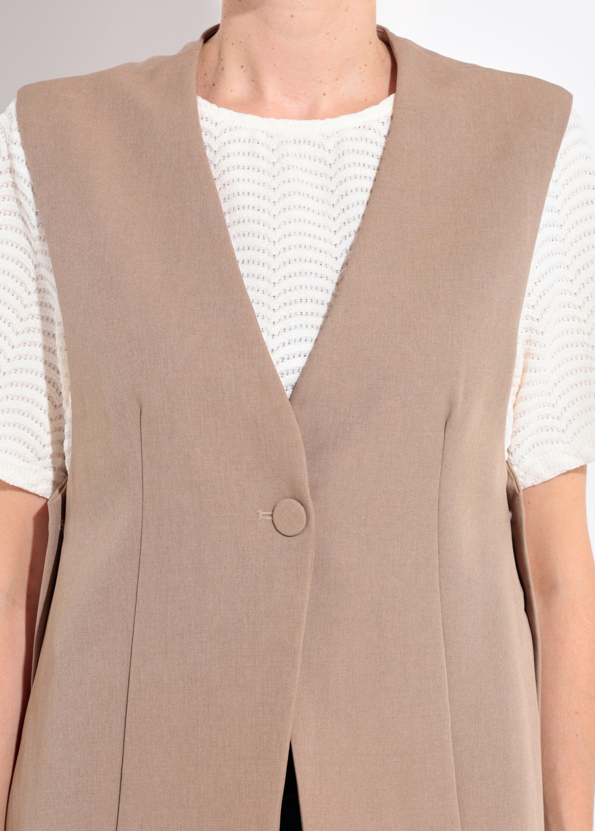 Gilet costume sans manches bouton côtés