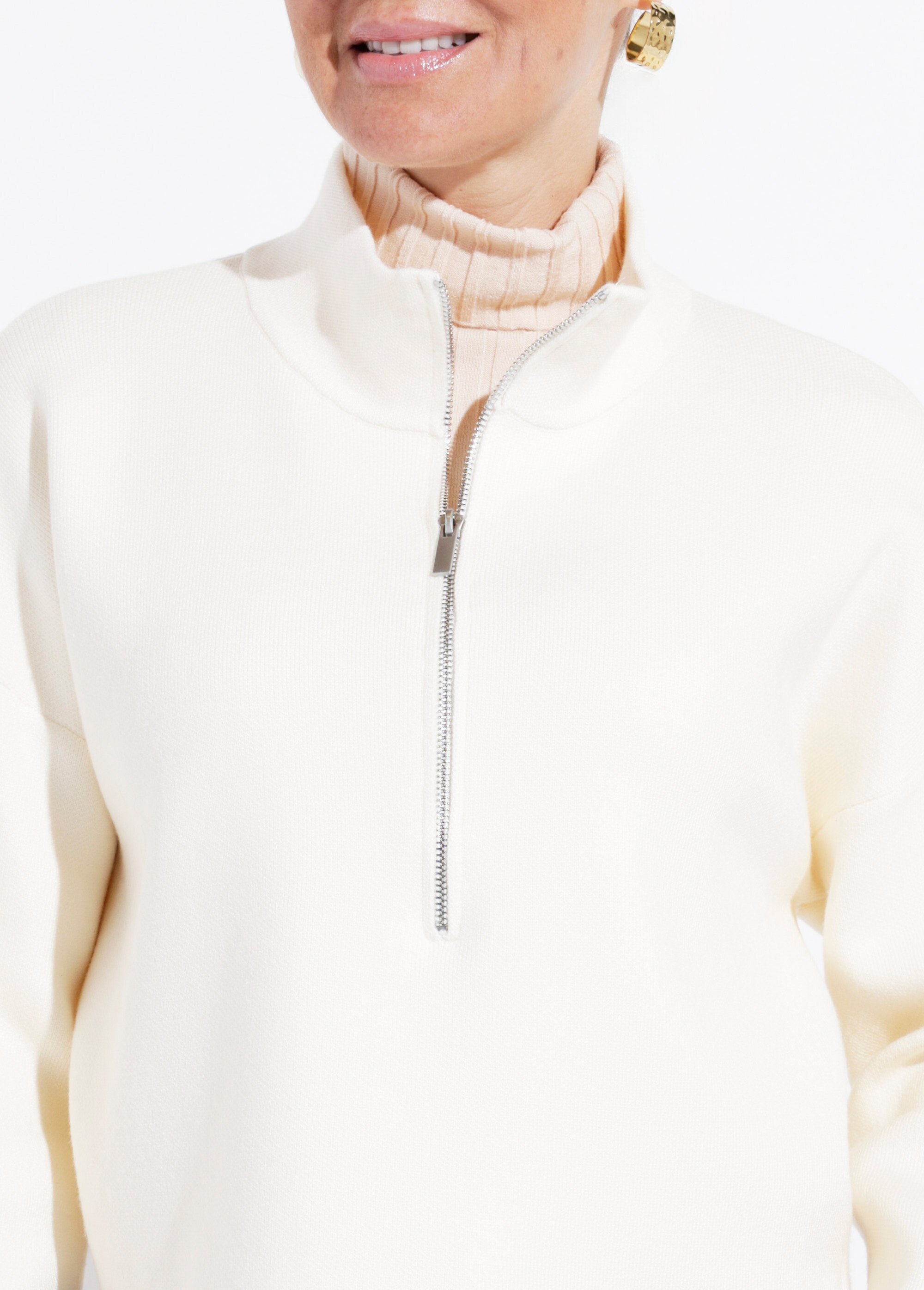 Pull court avec col montant zippé