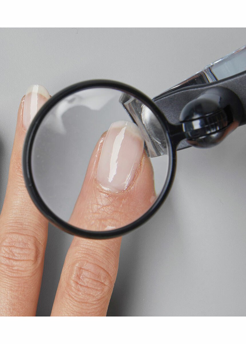 Coupe-ongles rotatif avec loupe