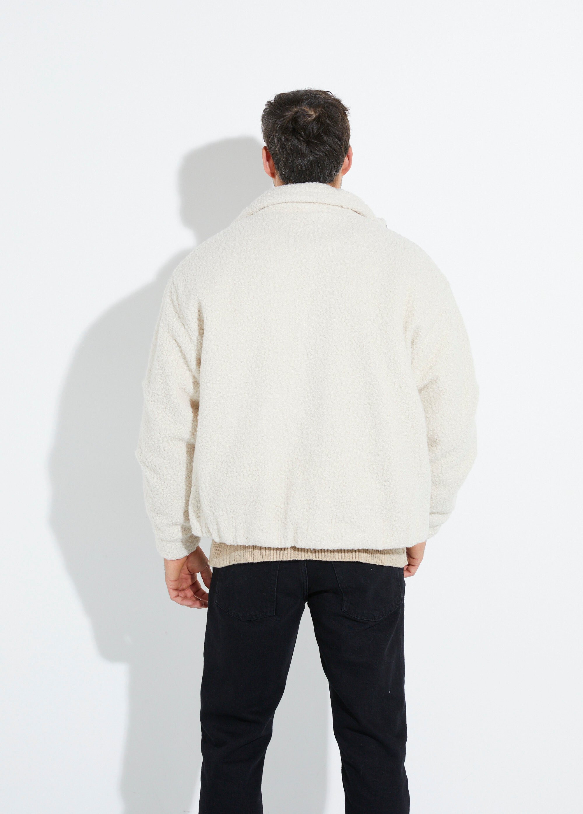 Blouson façon peau lainée, col montant